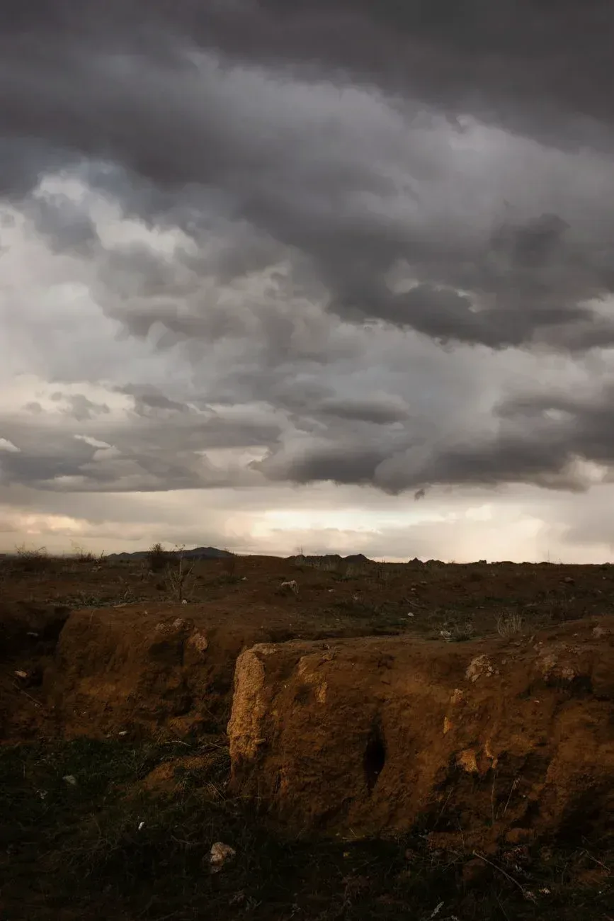 Storm cloud over a desert landscape