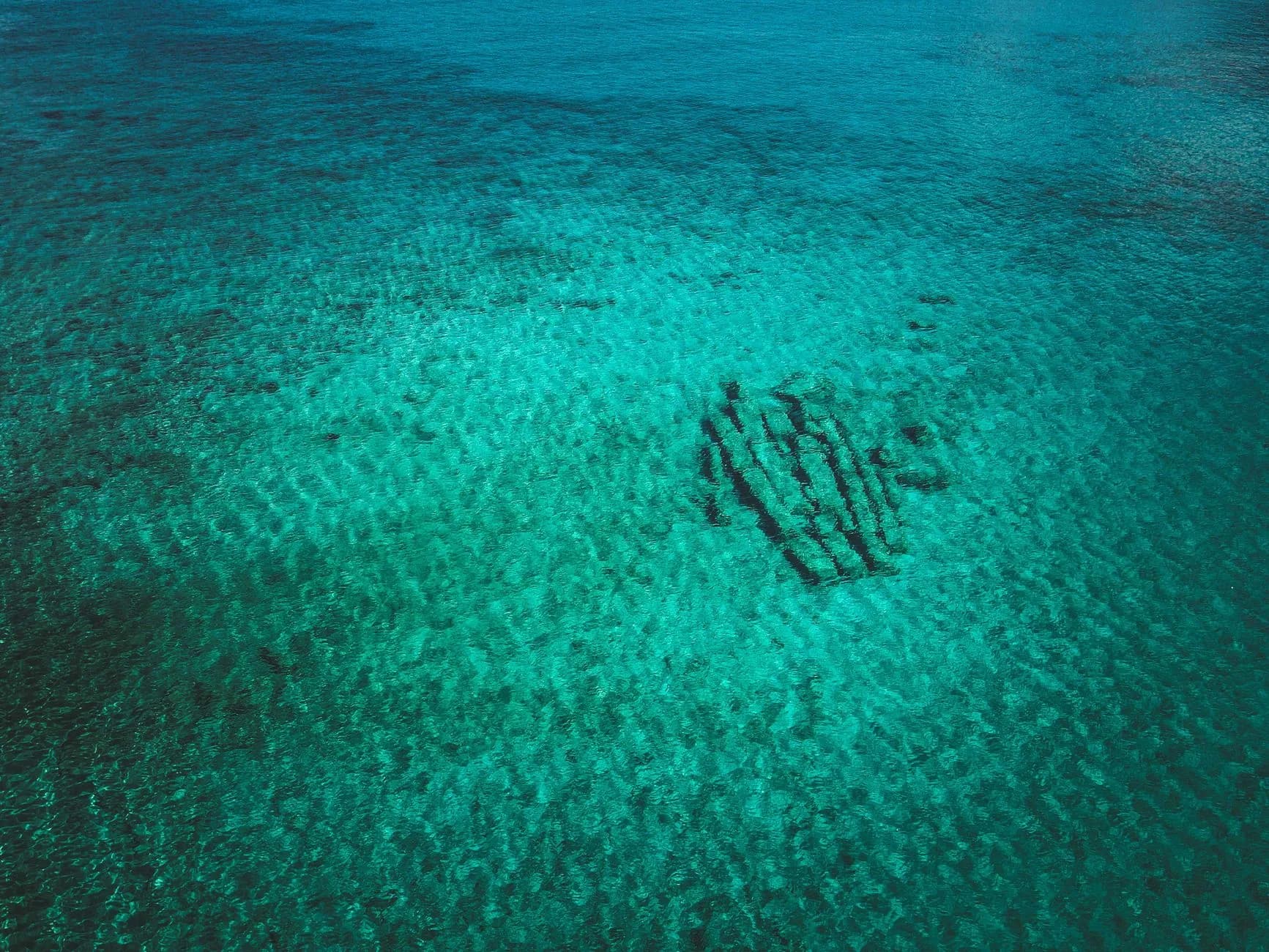Shallow clear water over a sandy seabed
