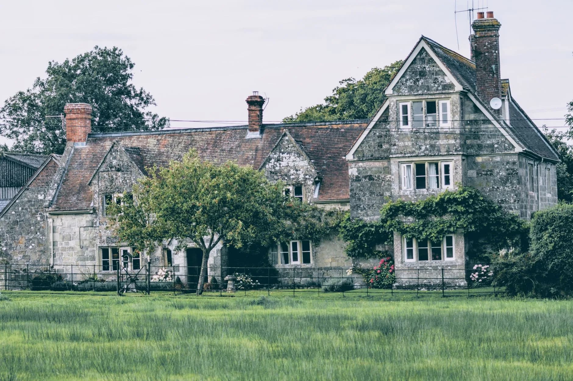 An old English country house among trees