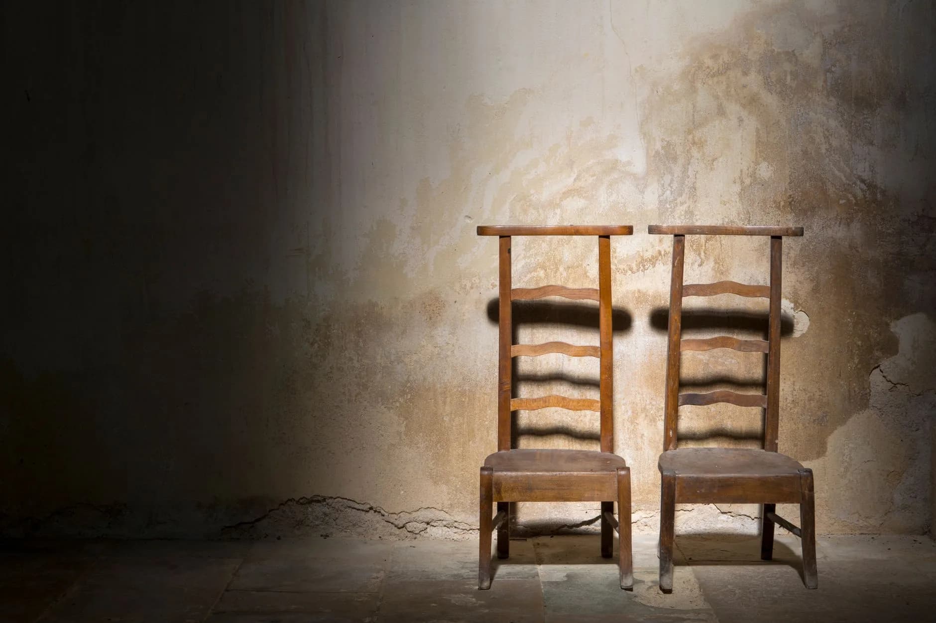 An empty chair in a bare room