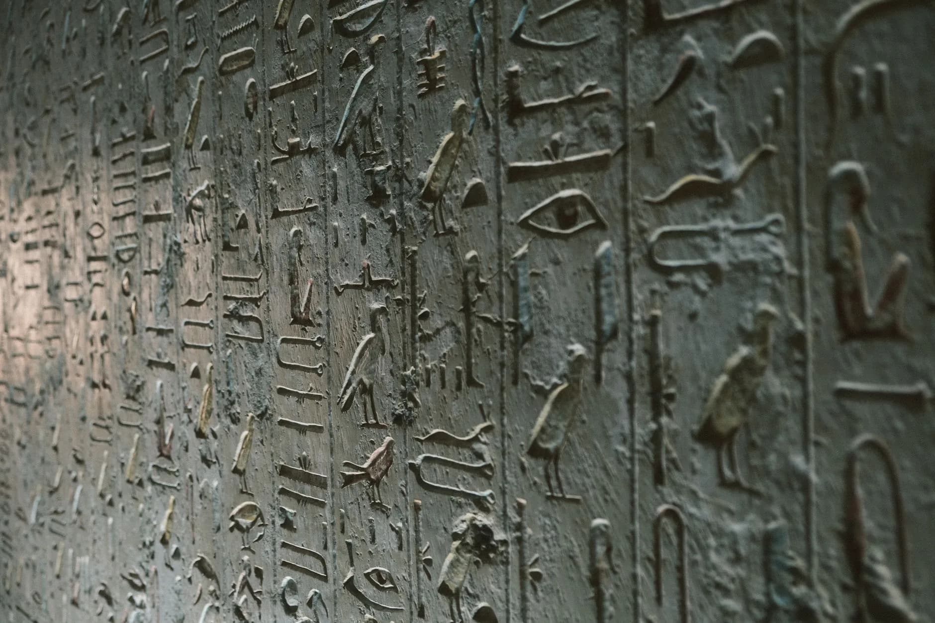 Egyptian hieroglyphs carved into a temple wall