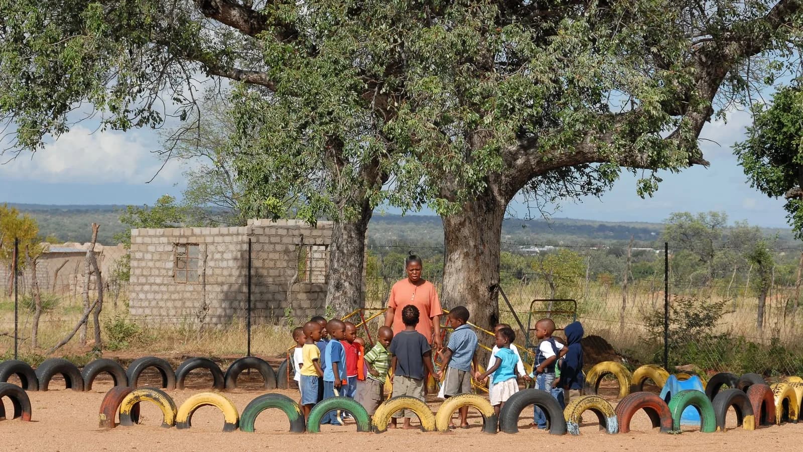 A school playground under trees