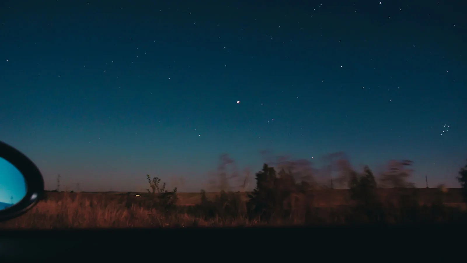 Night sky over open countryside