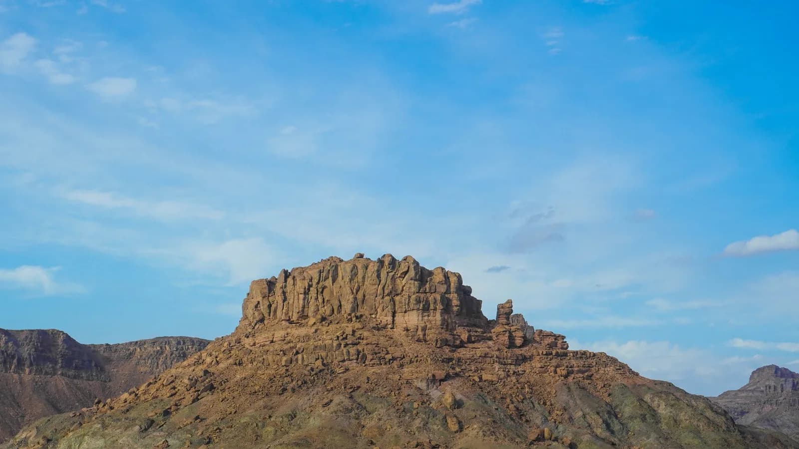 An eroded mesa in desert terrain