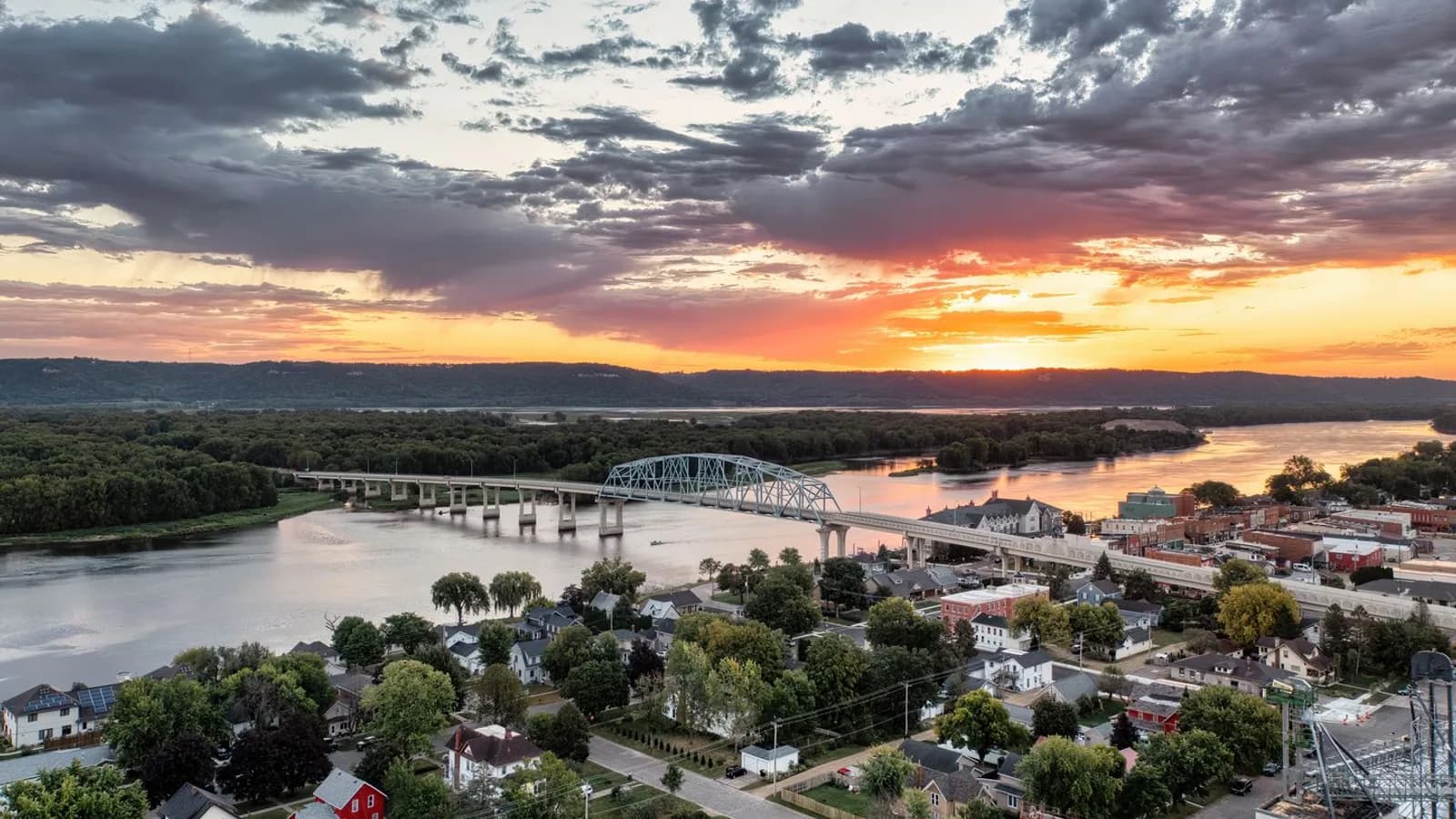 A small town by a river at dusk