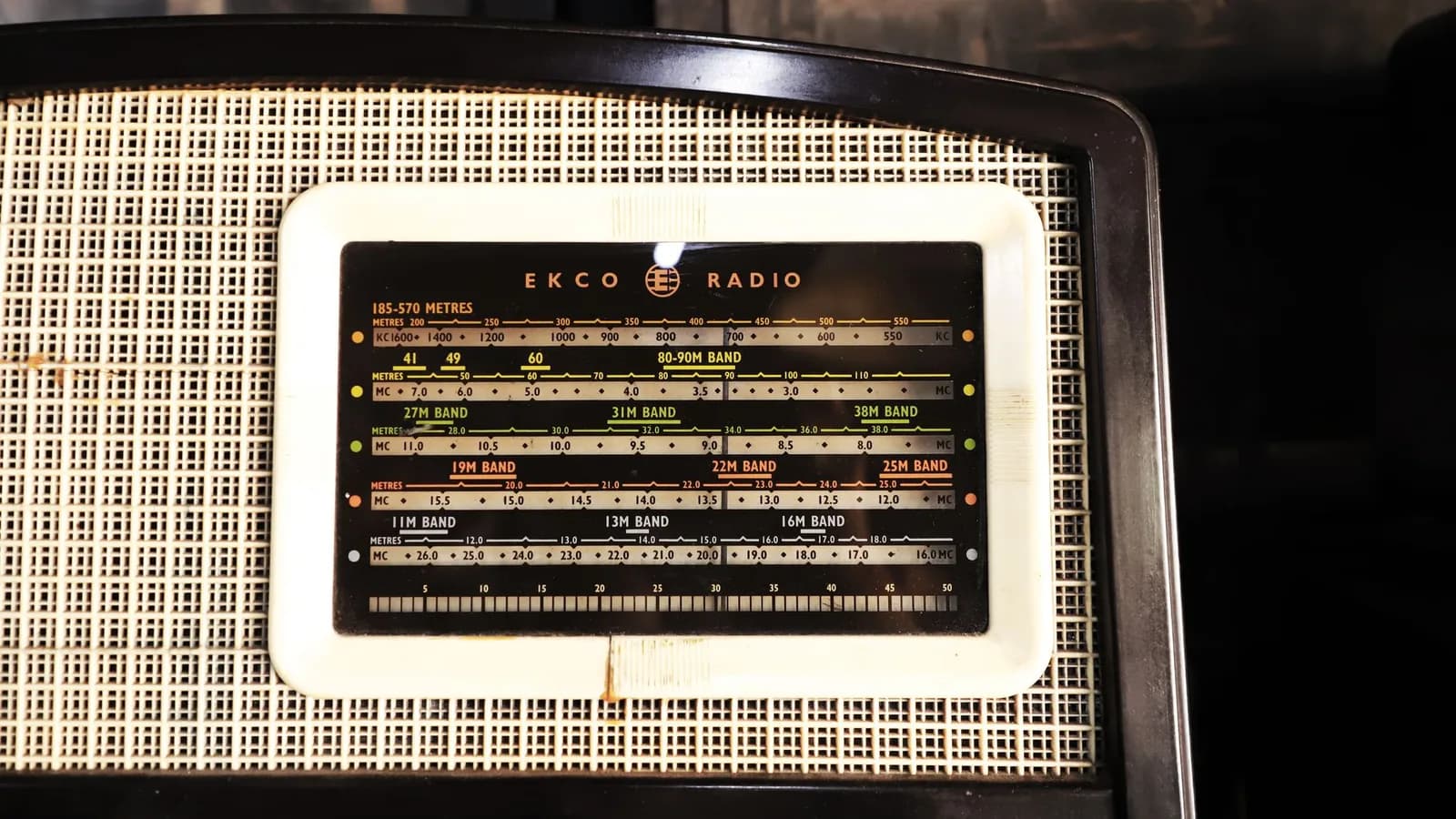 A vintage radio receiver with a frequency dial
