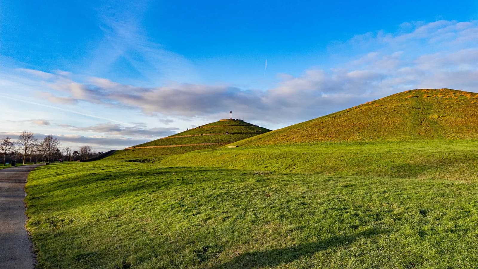 A large conical grassy mound