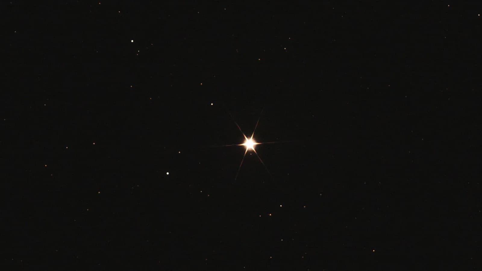 A bright star in a night sky