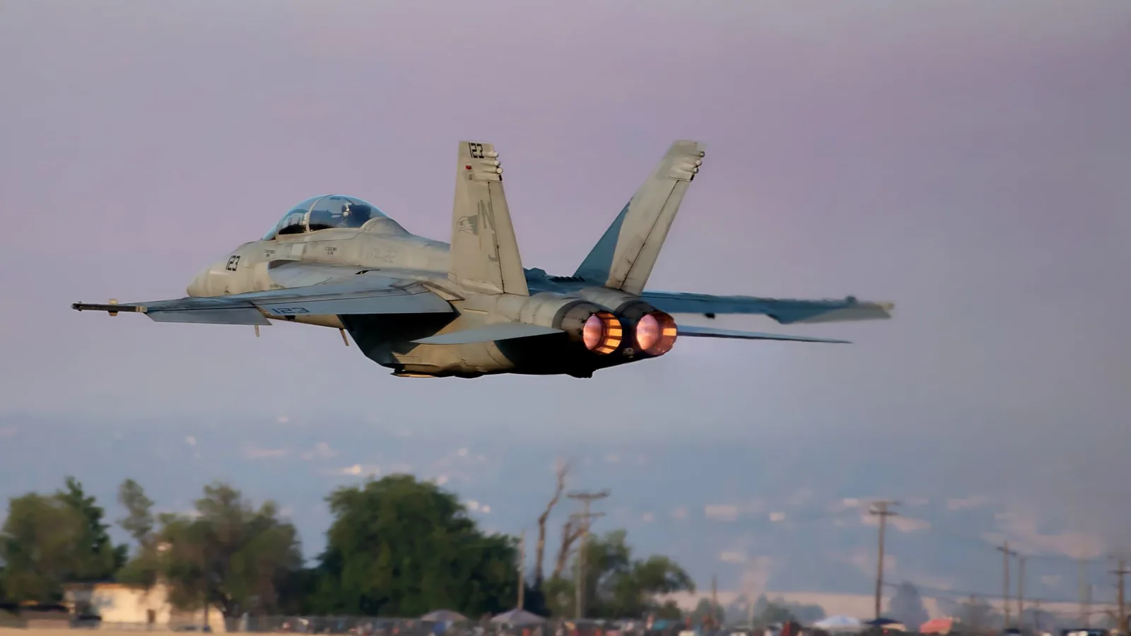 A jet aircraft with afterburners lit