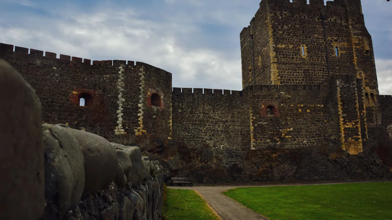 The stone walls and battlements of a medieval castle