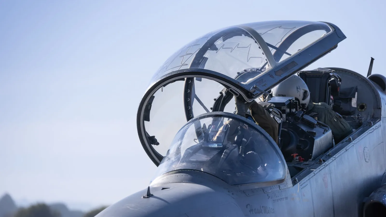 A fighter aircraft against a night sky
